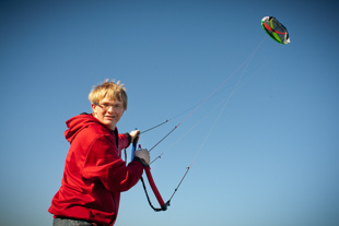 Logan Unser is flying his Power Kite.  He says it’s not a starter kite but one you have to work up to.  He also flies stunt kites. 
He recommends the hobby because it is a lot of fun and a big adrenalin rush, ‘it’s more exciting than it looks’.