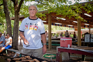 Joe Spies has been a member of the German American Central Society for 58 years. 
Today he is helping the organization by cooking pork chops for the Corn Boil fundraiser.