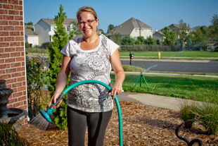 Melissa Fassino of Dunlap is watering her plants, trying to help them survive the heat. 
 ‘We just moved here this spring and have no trees for shade’ she said