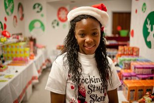 Catrina Warren is Volunteering at the Stocking Stuffer Store to benefit Crittenton Centers.
  She is a senior at Manuel High School and a member of the Tomorrow's Scientists, Technicians & Managers Program.  
Her volunteer work helps her get her required service hours, but she says it’s fun seeing the kids so happy.