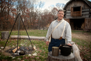 Tom Miller is the facility coordinator at Sommer Park in Peoria.  Today he is demonstrating how to make candles 
during Pioneer Days, which is an educational event showing the daily life of rural Peorians in the mid-19th century.