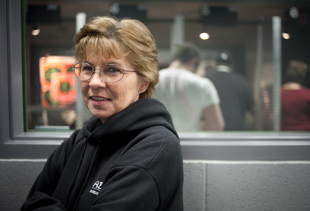 Rhonda Miller of Canton, IL is visiting the gun range at American Firearms in Peoria for the first time.
 Though she is no stranger to the shooting sports, ‘It’s fun’ she said, ‘I like out shooting the guys’