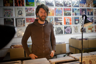 Matt McClellan helps out at his girlfriend’s record store, Ribbon Records in downtown Peoria. He says he enjoys 
exploring vintage and obscure vinyl records. ‘There is a lot of good music just below the surface’ he said.