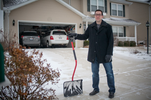 Mike Portscheller is the father of two boys, a 3 year old and a one week old.  
 The driveway had to be cleared because his mother is coming for a visit to see the new baby.