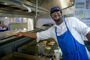 Moussa Doumbia, originally from the West African country of Mali, is a cook at IHOP, today is International Pancake Day. 
IHOP is giving away free pancakes and taking donations for the Children’s Miracle Network.
 Moussa thinks he will make more than 2,000 pancakes this morning.