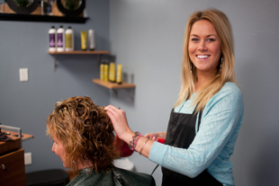 Ali Breitmeyer is a hair stylist at Wild Roots Salon. The best part of her job, 
‘Talking’, she said, ‘it’s girl time all the time here.’