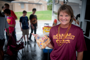 Lorrie Palladini Wu has been hosting a tailgate party for her 3 daughters and their friends at Dunlap’s homecoming game 
for the last 3 years. She is also a Realtor, but says being a mom and wife are her first jobs.