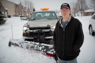 Kevin Shillinger has been up since 3:00 a.m. plowing snow for the City of Peoria.
 He works for a private contractor and likes the snow because it brings 
in money for his family. However, ‘I’m ready for spring’ he said.