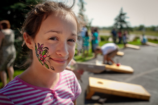 Angela Dugan, age 11, had her face painted at her church picnic.
 She is a 6th grader at Dunlap Middle School, she is learning to play the guitar and she likes flowers.