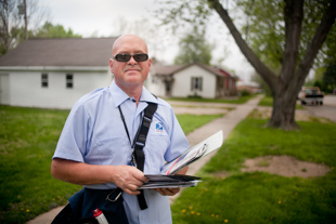 Marvin Irby has only been a postal carrier since October. His change in careers was motivated 
mostly by the economy. He does not mind his more than 10 miles of walking each day 
because, ‘I like the outdoors and meeting and getting to know the people,’ he said.