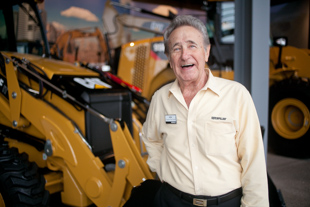 Ken Gerber is a host at the New Caterpillar Visitor Center.  He retired from Caterpillar 22 years ago where
 he started sweeping floors in the offices and 36 years later was a manager in the customer services department.  
 He said Caterpillar is a great company because there is a culture of dedication to quality.