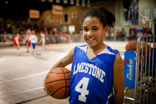 Jada Lane is a third grader and plays on a 5th and 6th grade AYBT basketball team.  Her team played during Peoria’s
 March Madness Experience and won.  She said she likes playing basketball, ‘because it’s fun.’