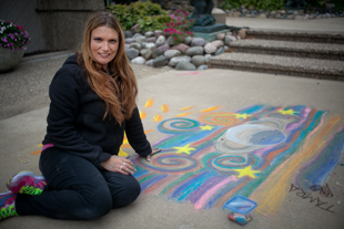 Tamra Antenucci is participating in ‘Chalk the Walk’ at Tower Park in Peoria Heights for the fun of it.  
Her full time job is a different kind of art, she performs with LED and Fire hoops at events and parties.